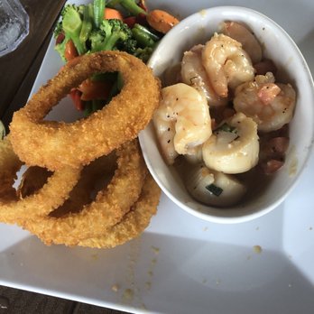 Caribbean Jack's - Shrimp and scallops with onion rings and veggies. - Caribbean Near Me - Daytona Beach, Florida Caribbean Jack's - Shrimp and scallops with onion rings and veggies. - Caribbean Near Me - Daytona Beach, Florida