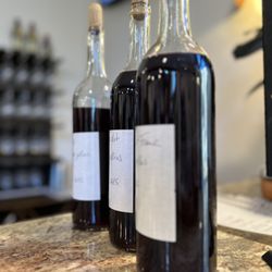Grande River Vineyards - Red wine being sampled for quality and readiness for bottling.
