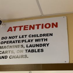 K Laundrymat - This sign is meant for the customer's children but clearly not their own.