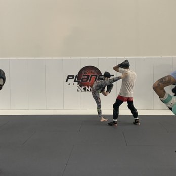 10th Planet Denver - Coach Heather teaching kickboxing - Brazilian Jiu-jitsu Near Me - Wheat Ridge, Colorado