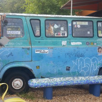 Satchel's Pizza - The old bus with seating inside. - Pizza Near Me - Gainesville, Florida