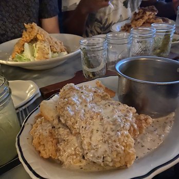 Jacob's Pickles - Closest - Sausage Gravy Smothered Chicken Back left - Buttermilk Fried Chicken Caesar Salad Back right - Chicken & Pancakes - Comfort Food Near Me - New York, New York Jacob's Pickles - Closest - Sausage Gravy Smothered Chicken Back left - Buttermilk Fried Chicken Caesar Salad Back right - Chicken & Pancakes - Comfort Food Near Me - New York, New York
