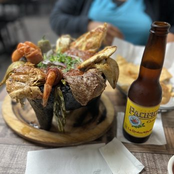Mariscos Los Chavalones - Molcajeté Mar y Tierra with a beer - Seafood Near Me - Anaheim, California Mariscos Los Chavalones - Molcajeté Mar y Tierra with a beer - Seafood Near Me - Anaheim, California
