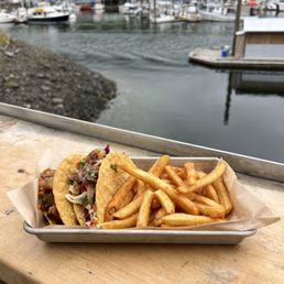Alaska Tacos: 1 halibut and 1 salmon blackened hard taco with a side of fries $25.91 after tax Alaska Tacos: 1 halibut and 1 salmon blackened hard taco with a side of fries $25.91 after tax