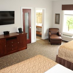 Riverwalk Place - Double Queen Hotel Room at Riverwalk Place Resort & Spa. The TV and view from beds.
