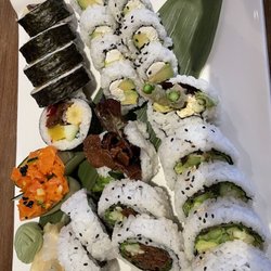 Vegan Shoku - Rolls: Beef teriyaki (bottom left), futomaki (top left), avocado cream cheese (top right), dynamite (bottom right); + spicy salmon nigiri