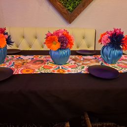 We added the center pieces and table center cloth. Restaurant proved black and red linen. We added the center pieces and table center cloth. Restaurant proved black and red linen.
