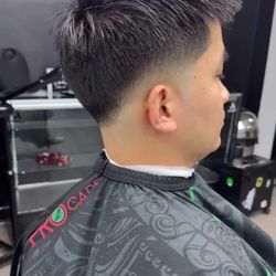 Hugo’s Barbershop - Precision fade with clean blend and natural finish.