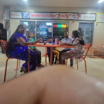 Laliguras - a group of people sitting at a table - Noodles Near Me - Leander, Texas