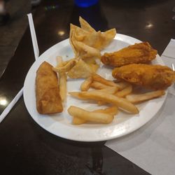 Asian Buffet - Crab rangoons, egg roll, fries, and chicken wings. Lackluster plate, I know, but this is only food picture I have of this place