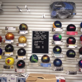 Lodge Lanes - The various selection of balls and the prices to have them drilled. - Bowling Near Me - Belleville, Michigan