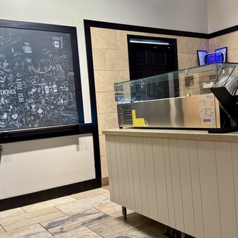 European Taste - Seating, decor, and side counter by the drink prep area. - Coffee & Tea Near Me - West Des Moines, Iowa European Taste - Seating, decor, and side counter by the drink prep area. - Coffee & Tea Near Me - West Des Moines, Iowa