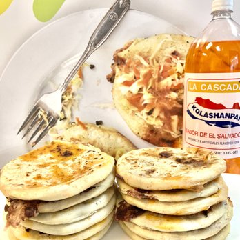 Guana Cafe - a plate of pancakes and a bottle of syrup - Salvadoran Near Me - Irving, Texas Guana Cafe - a plate of pancakes and a bottle of syrup - Salvadoran Near Me - Irving, Texas