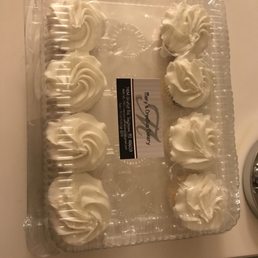 a cake with white frosting