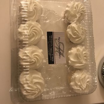 Mary's Creative Cakery - a cake with white frosting - Bakeries Near Me - Saginaw, Michigan