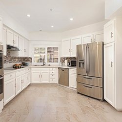 Staged Homes Real Estate - We had the seller paint out these chocolate brown cabinets to Matt white! Wow!