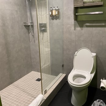 The Moment Hotel - a bathroom with a toilet and shower - Hotels Near Me - Los Angeles, California The Moment Hotel - a bathroom with a toilet and shower - Hotels Near Me - Los Angeles, California