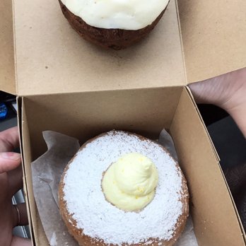 Doe Donuts - Yuzu filled donut on bottom and carrot cake donut on top. The Yuzu was the worth it winner. - Donuts Near Me - Portland, Oregon Doe Donuts - Yuzu filled donut on bottom and carrot cake donut on top. The Yuzu was the worth it winner. - Donuts Near Me - Portland, Oregon