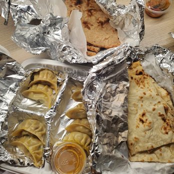 Tibet Nepal House - Chicken momos (bottom left), dhopzi (upper package with the brown flatbread), naan, and the Nepali pickles. - Himalayan/Nepalese Near Me - Pasadena, California Tibet Nepal House - Chicken momos (bottom left), dhopzi (upper package with the brown flatbread), naan, and the Nepali pickles. - Himalayan/Nepalese Near Me - Pasadena, California