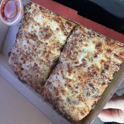 Pizza Hut - Uncut breadsticks cut in half
