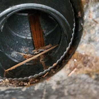 50Floor - the inside of a pipe with a wooden stick sticking out of it - Flooring Near Me - Nashville, Tennessee