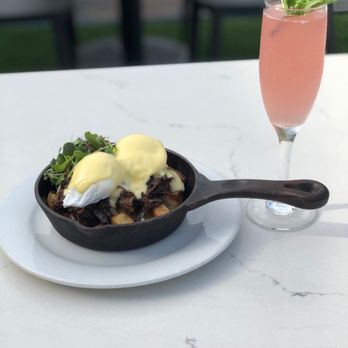 Novecento - Short rib eggs Benedict and grapefruit mimosa - Argentine Near Me - Key Biscayne, Florida Novecento - Short rib eggs Benedict and grapefruit mimosa - Argentine Near Me - Key Biscayne, Florida