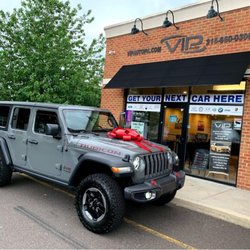 VIP Auto Of PA - Gray Jeep Wrangler with a red bow outside VIP Auto PA in Feasterville-Trevose, Pennsylvania.