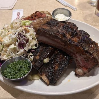 Wood Ranch Irvine - Beef ribs with a side of baked potato and peanut slaw - Barbeque Near Me - Irvine, California Wood Ranch Irvine - Beef ribs with a side of baked potato and peanut slaw - Barbeque Near Me - Irvine, California