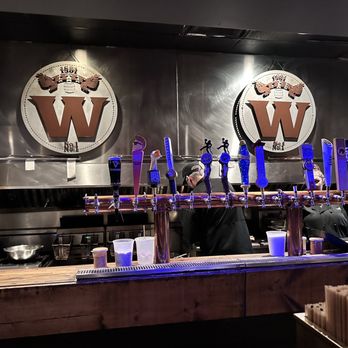 The Whiskey - a man and a woman behind a bar - American Near Me - Orlando, Florida The Whiskey - a man and a woman behind a bar - American Near Me - Orlando, Florida