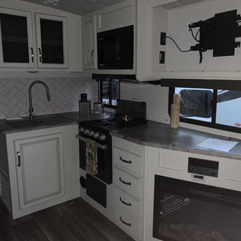 Curtis Trailers - Beaverton - Kitchen, fireplace, TV - RV Dealers Near Me - Aloha, Oregon