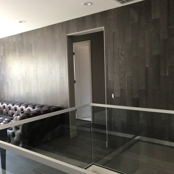 US Mega Flooring - a living room with a couch and a coffee table - Flooring Near Me