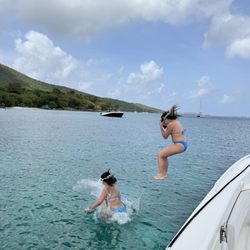 Caribbean Alibi Boat Charters - Jumping off of Black Bart