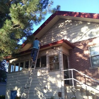 Upkeep Utah - a man on a ladder painting a house - General Contractors Near Me Upkeep Utah - a man on a ladder painting a house - General Contractors Near Me