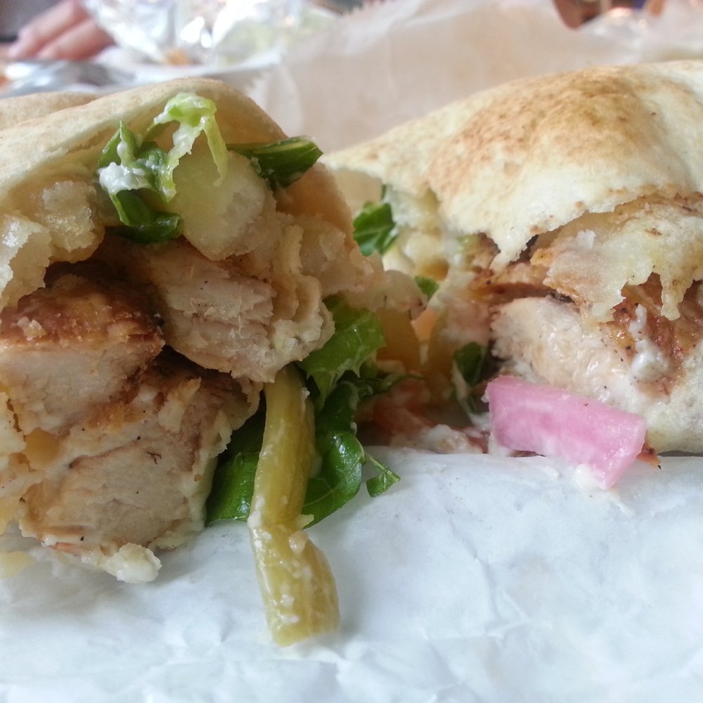 Flint Farmers' Market - Enaya's Special: chicken breast,  French fries, lettuce, tomato, red & green pickles and garlic sauce! - Farmers Market Near Me - Flint, Michigan