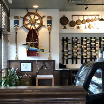 Greektown Taverna - Wine wall with a dessert showcase - Greek Near Me - Naples, Florida