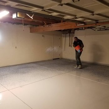 Epoxy Armor Systems - My installer spreading the flakes on the floor during the process of installation. - Flooring Near Me - Rancho Cordova, California Epoxy Armor Systems - My installer spreading the flakes on the floor during the process of installation. - Flooring Near Me - Rancho Cordova, California