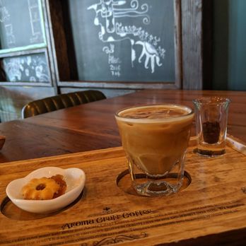 Aroma Craft Coffee - Iced Gibraltar with a pineapple cookie and fine coffee beans to smell! - Coffee Roasteries Near Me - Walnut, California