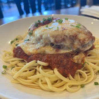Stella Point Grille - Chicken Parmesan on linguine over marinara. - Bars Near Me - Kensington, Maryland Stella Point Grille - Chicken Parmesan on linguine over marinara. - Bars Near Me - Kensington, Maryland