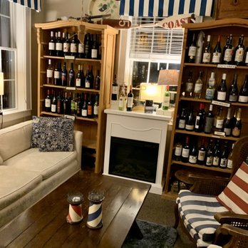 Lake Norman Cottage - a living room with wine bottles on the shelves - Tapas/Small Plates Near Me - Davidson, North Carolina Lake Norman Cottage - a living room with wine bottles on the shelves - Tapas/Small Plates Near Me - Davidson, North Carolina