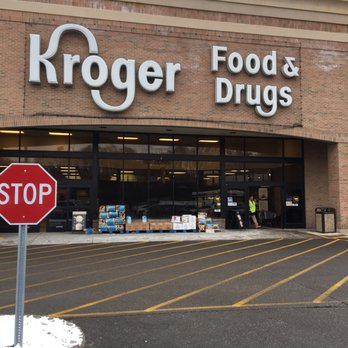 Kroger - a stop sign in front of a store - Grocery Near Me - Indianapolis, Indiana