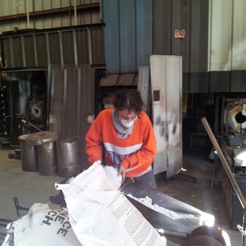 Gott Glass Gallery and Phoenix Studio - Pouring out material to add to the kiln. - Art Galleries Near Me - Tampa, Florida