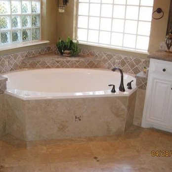 Regency Quality Construction - a bathtub in a bathroom - General Contractors Near Me Regency Quality Construction - a bathtub in a bathroom - General Contractors Near Me