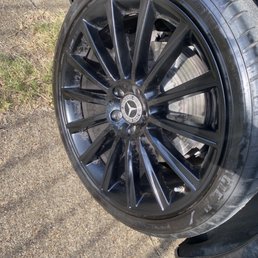 Rim and tire that is hardly shined and still has dirt all over. Rim and tire that is hardly shined and still has dirt all over.