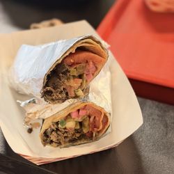 Yaba’s Middle Eastern Street Food - Lamb Shawarma with tahini, shatta, and pickled radish and also pickles.