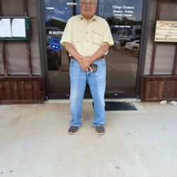Village Cleaners - A picture on the owner