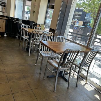 The Corner - Seating by the glass doors that open to the patio. 10 years ago this space was a Dairy Queen location . - Sandwiches Near Me - Boulder, Colorado