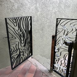 Merlin Metals - "Topograin" metal breezeway gate. Replacing old wooden gate. Custom design.