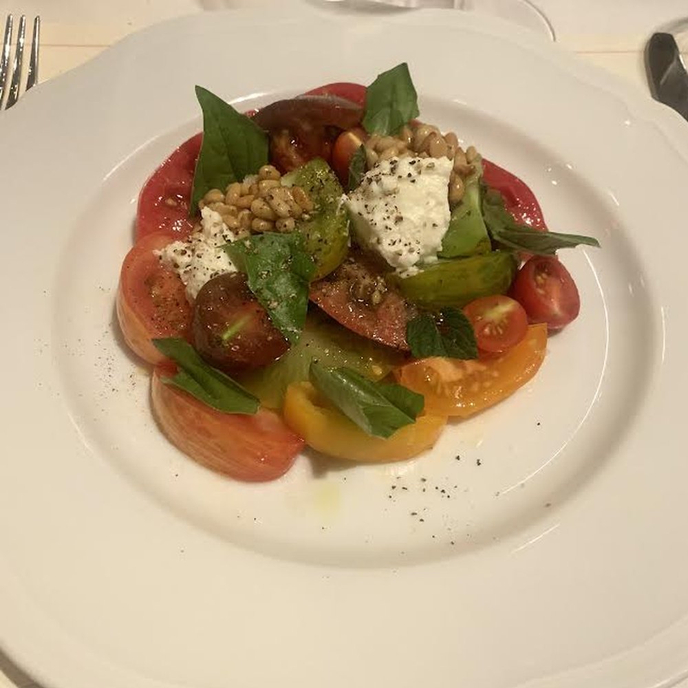 Heirloom tomato with eckerton hill tomatoes, goat cheese, pine nuts, basil