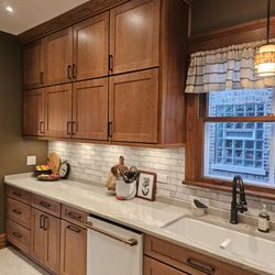 Design Concepts Expert Contractors - Custom porcelain, horizontal backsplash, quartzite countertops under cabinet lighting, cabinets and crown molding kitchen design and remodel