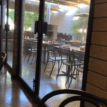 The Parlor - Outdoor dining area is pleasant also with fireplace - Pizza Near Me - Phoenix, Arizona The Parlor - Outdoor dining area is pleasant also with fireplace - Pizza Near Me - Phoenix, Arizona
